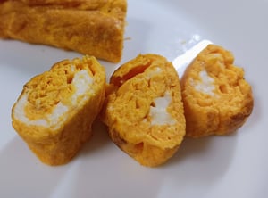 娘が巻いた卵焼きの画像